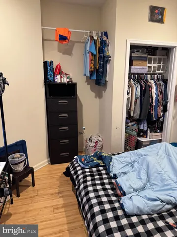 a bedroom with a bed and cabinets