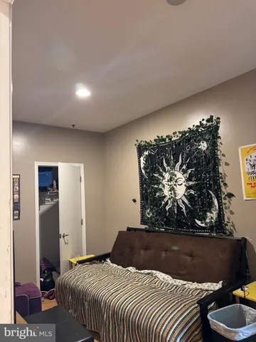 a very nice looking room with a big mirror and a wooden floor