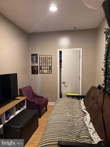 a view of a livingroom with furniture and a window