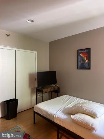 a view of a room with wooden floor