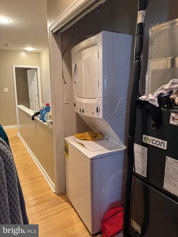 a view of walk in closet with clothes