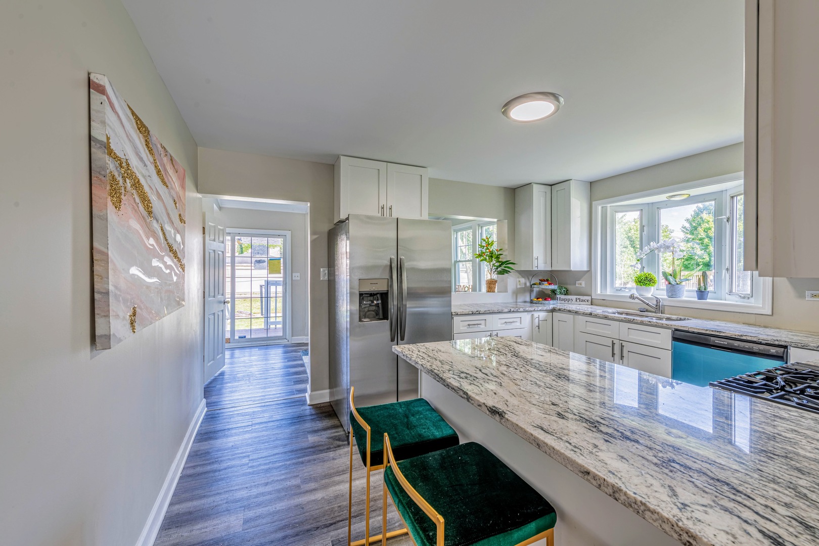 3340 Maple Avenue Brookfield, IL 60513 - Photo 11 of 26 a large kitchen with kitchen island a large counter space a sink appliances and a center island