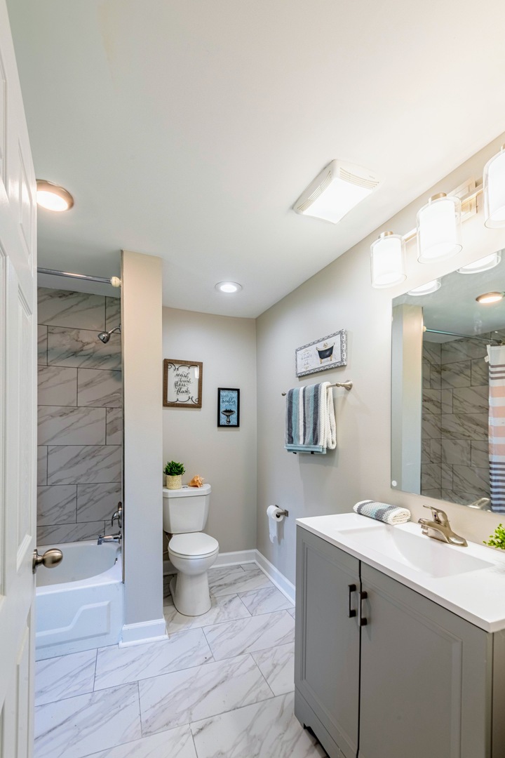 3340 Maple Avenue Brookfield, IL 60513 - Photo 15 of 26 a bathroom with a sink a toilet and shower