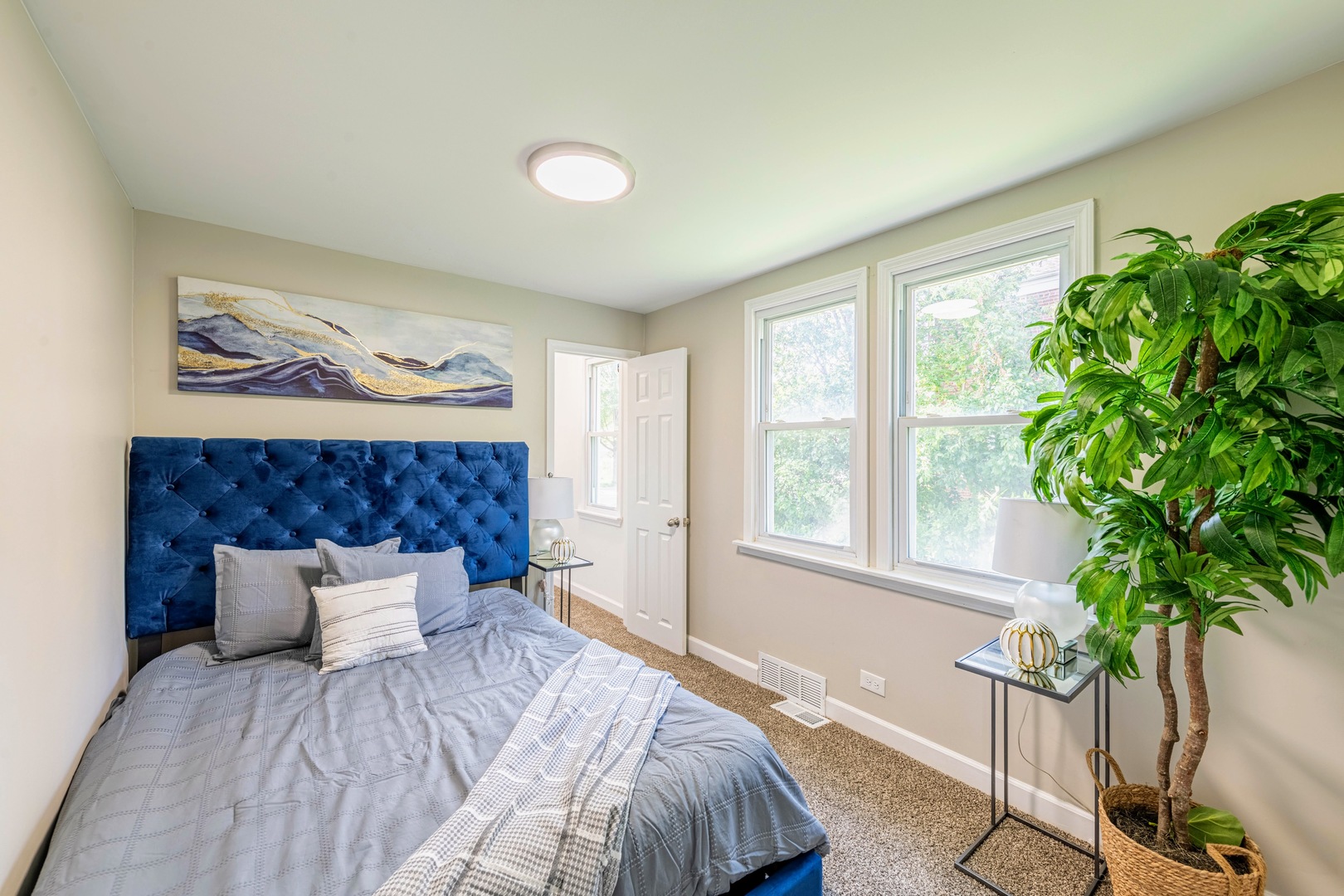 3340 Maple Avenue Brookfield, IL 60513 - Photo 17 of 26 a bedroom with a bed and a potted plant