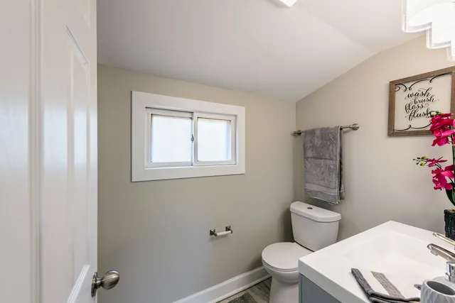 a bathroom with a sink shower and a mirror