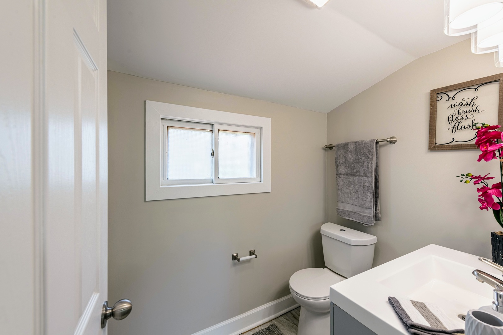 3340 Maple Avenue Brookfield, IL 60513 - Photo 21 of 26 a white toilet sitting next to a bathroom sink