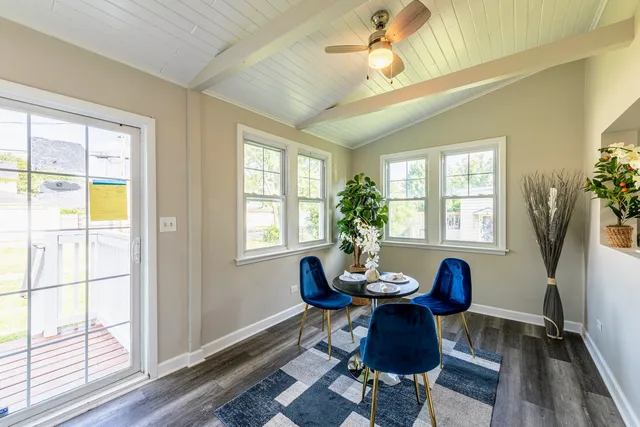 a view of a dining room with furniture window and wooden floor