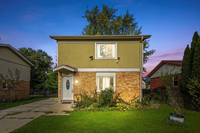 front view of a house with a yard