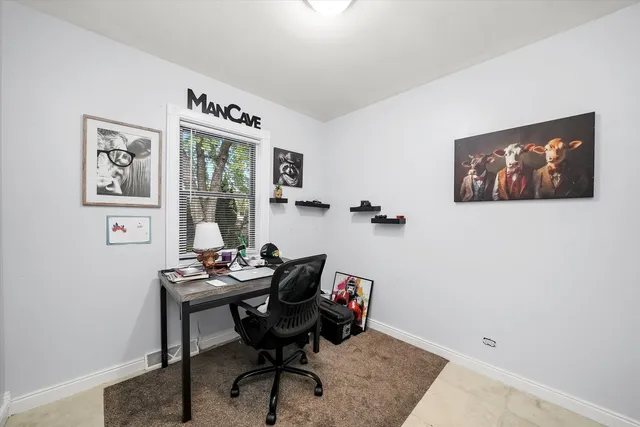 a workspace with furniture and window