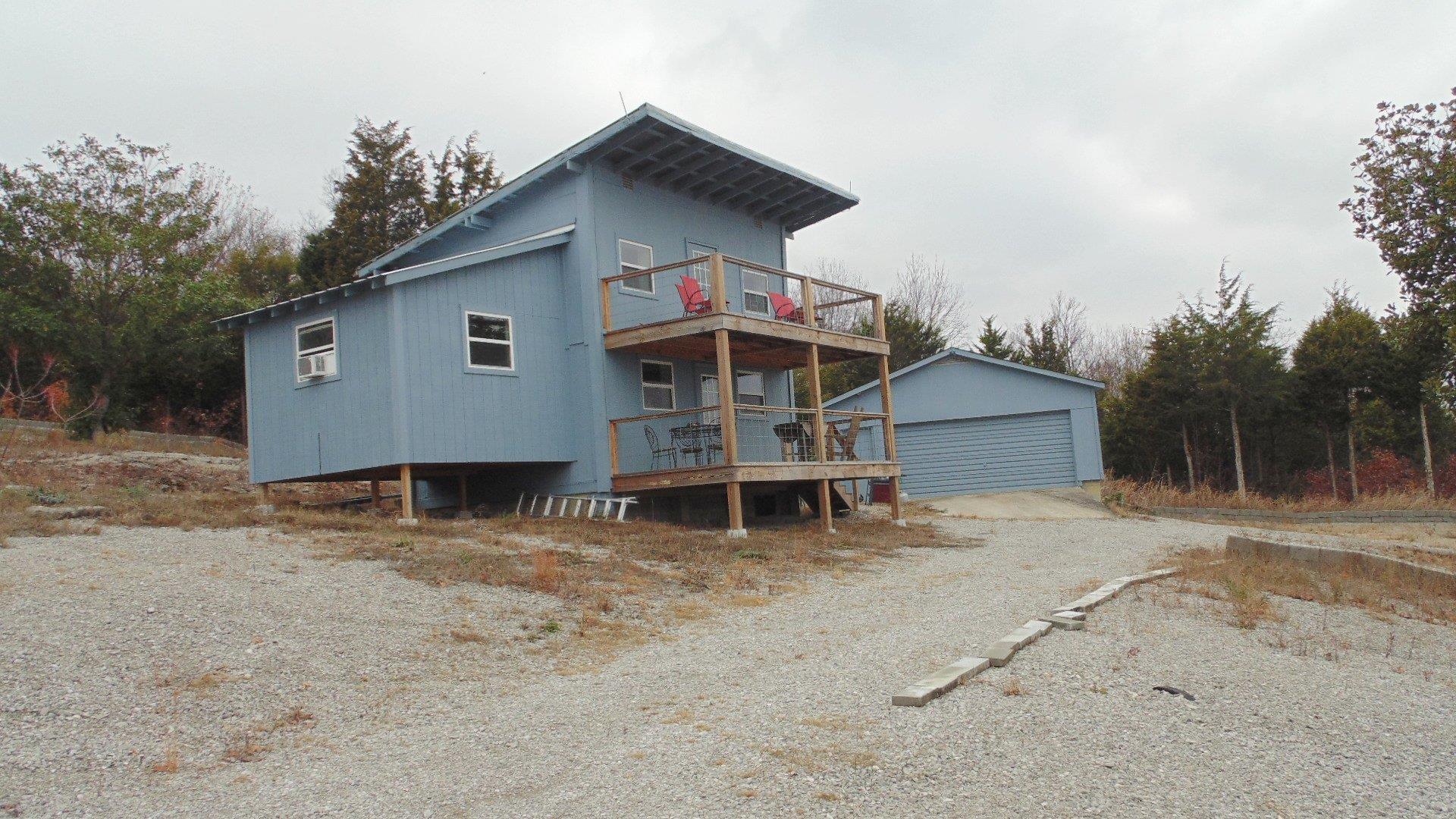 929 Cedar Mountain Road Decherd, TN 37324 - Photo 1 of 15 a front view of a house with a yard