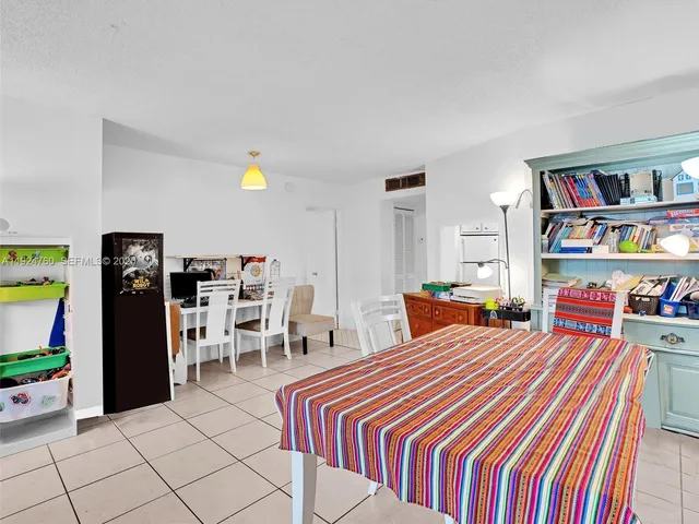 a room with furniture and musical instruments