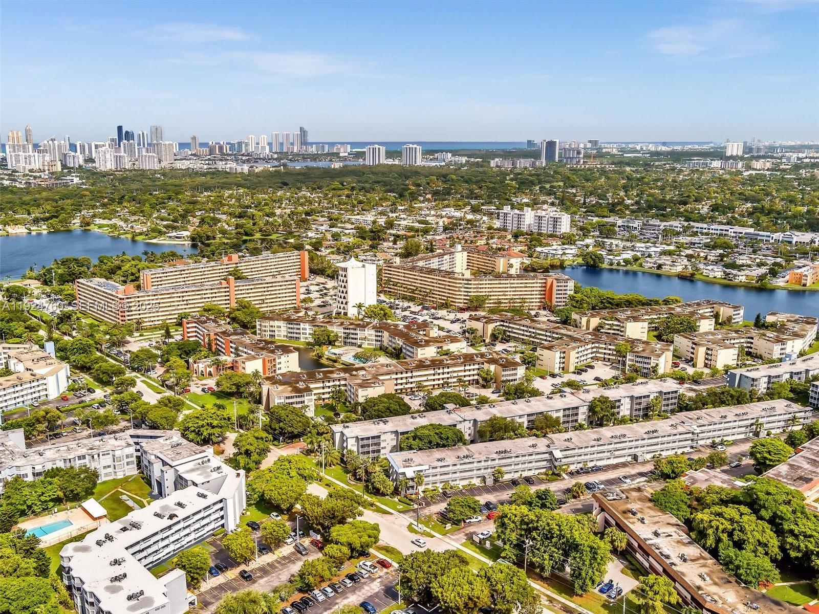 1780 Northeast 191st Street, Unit 2052 Miami, FL 33179 - Photo 36 of 51 an aerial view of residential building and lake view