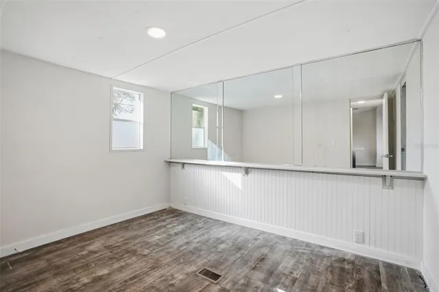 a view of an empty room with a window