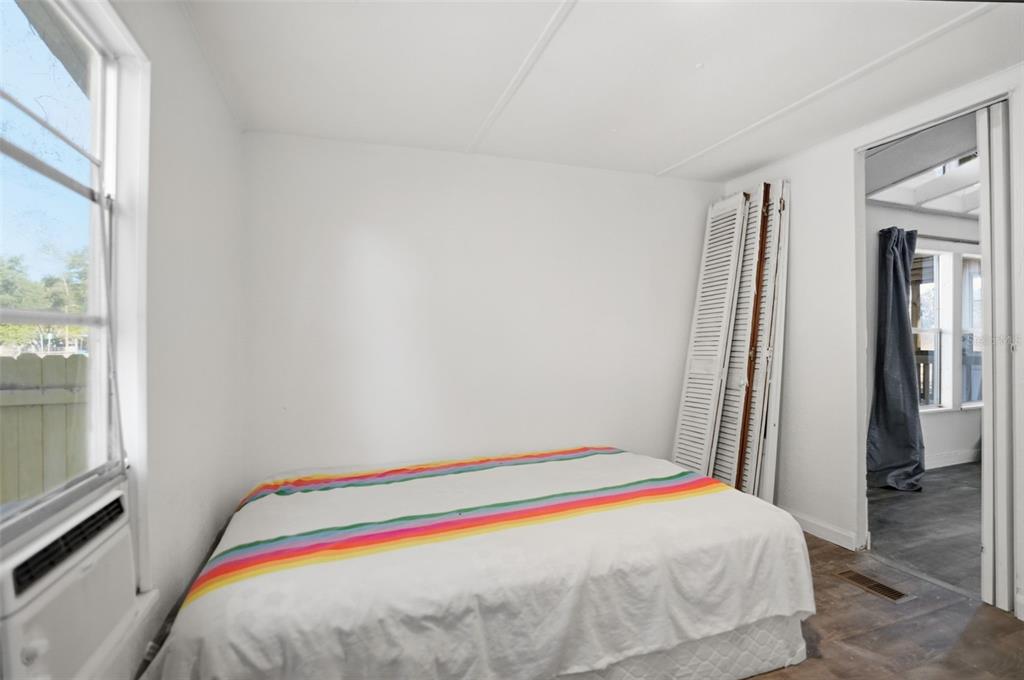 25256 Richbarn Road Brooksville, FL 34601 - Photo 15 of 32 a bedroom with a bed and a window