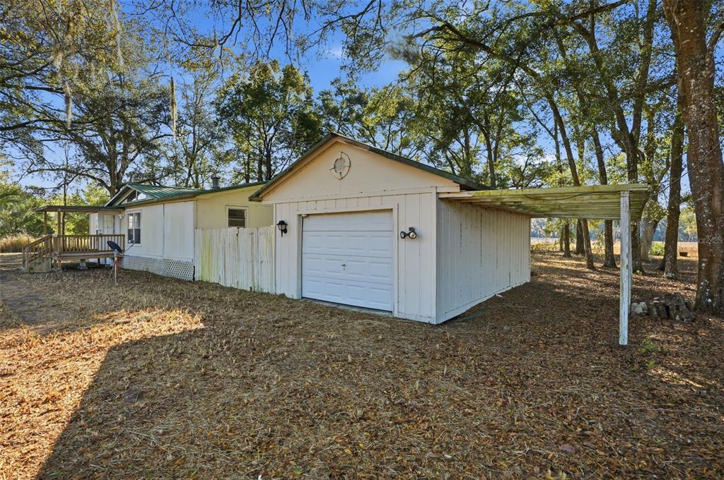25256 Richbarn Road Brooksville, FL 34601 - Photo 25 of 32 a view of a house with a yard