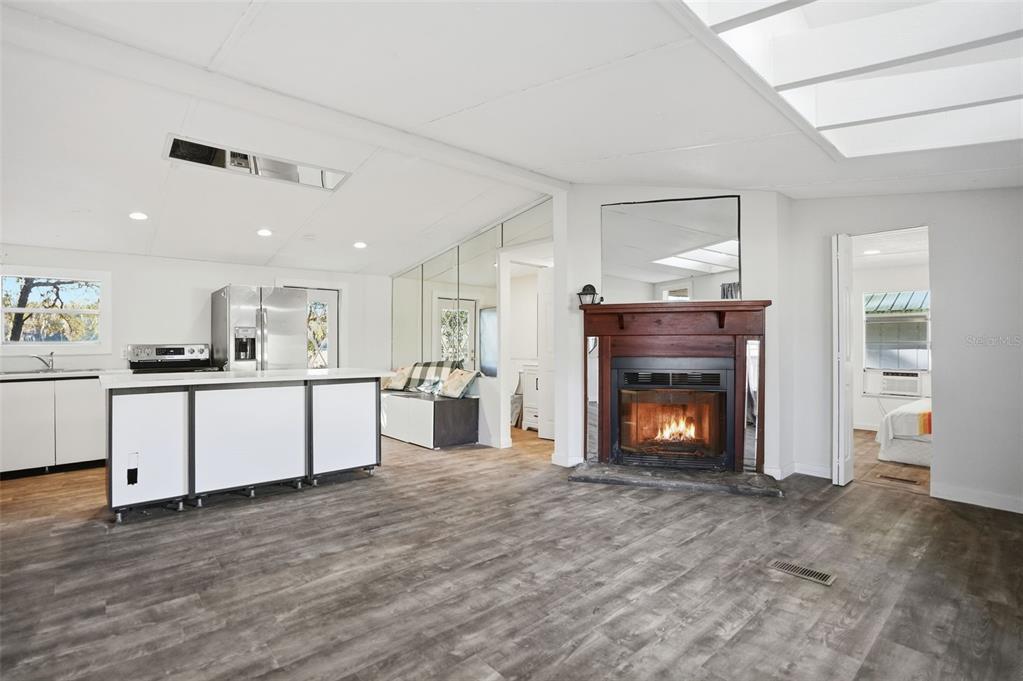 25256 Richbarn Road Brooksville, FL 34601 - Photo 4 of 32 a living room with furniture and a fireplace