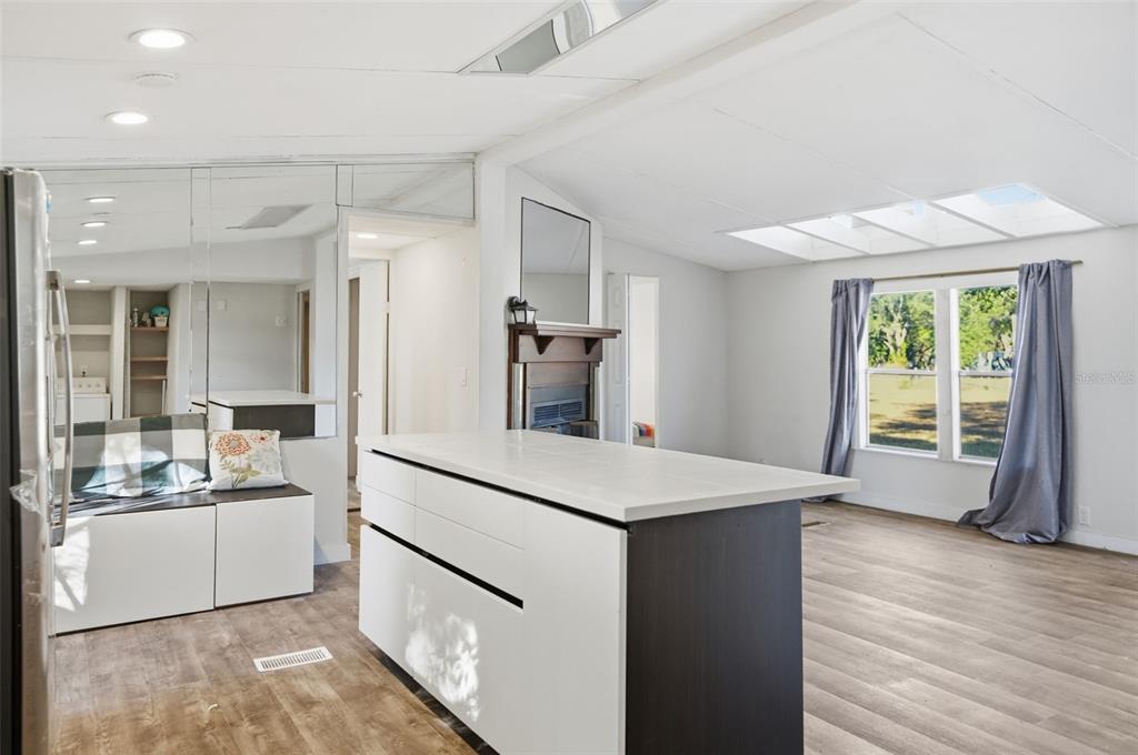 25256 Richbarn Road Brooksville, FL 34601 - Photo 8 of 32 a kitchen with a sink appliances and cabinets