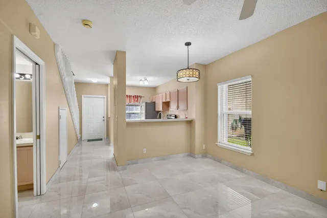 a view of a kitchen with furniture and a window