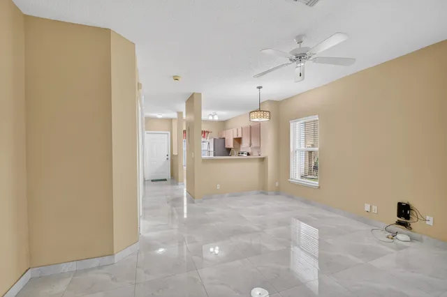 a view of a kitchen with a sink and cabinets
