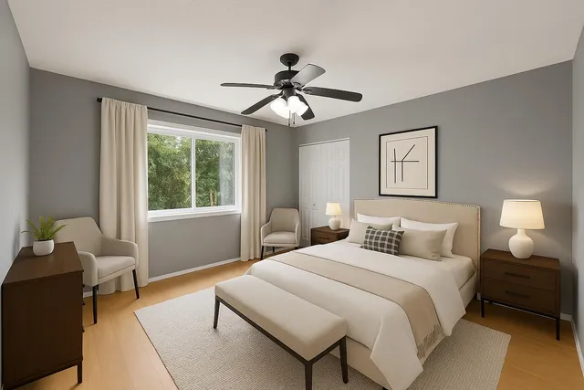 a view of an empty room and chandelier fan