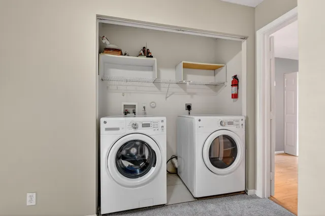 a view of hallway with washer and dryer