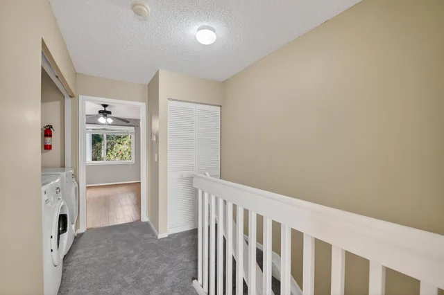 a view of a backyard with sitting area and garden