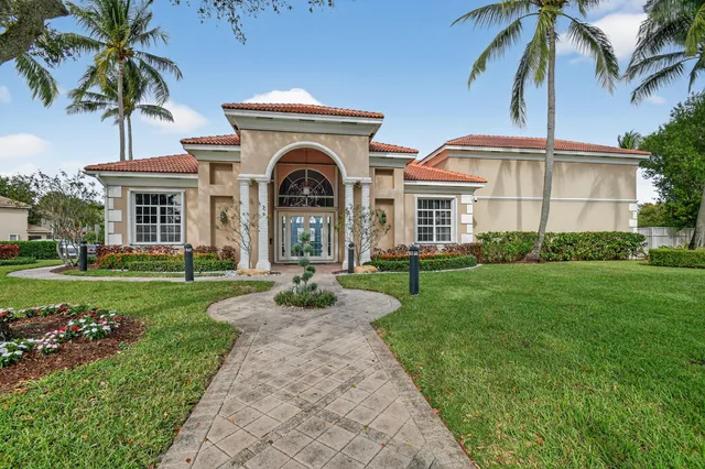 a swimming pool with outdoor seating and yard