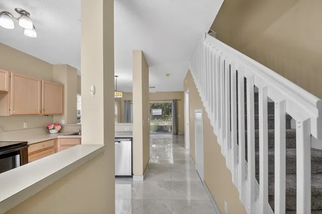 a view of a kitchen from the hallway