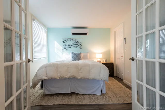 a bedroom with a bed and a window