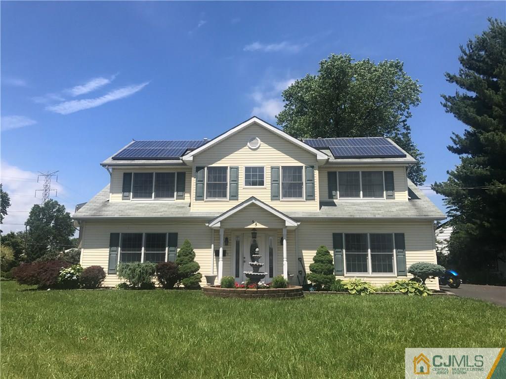 55 Knollwood Road Edison, NJ 08817 - Photo 1 of 25 a front view of a house with a garden