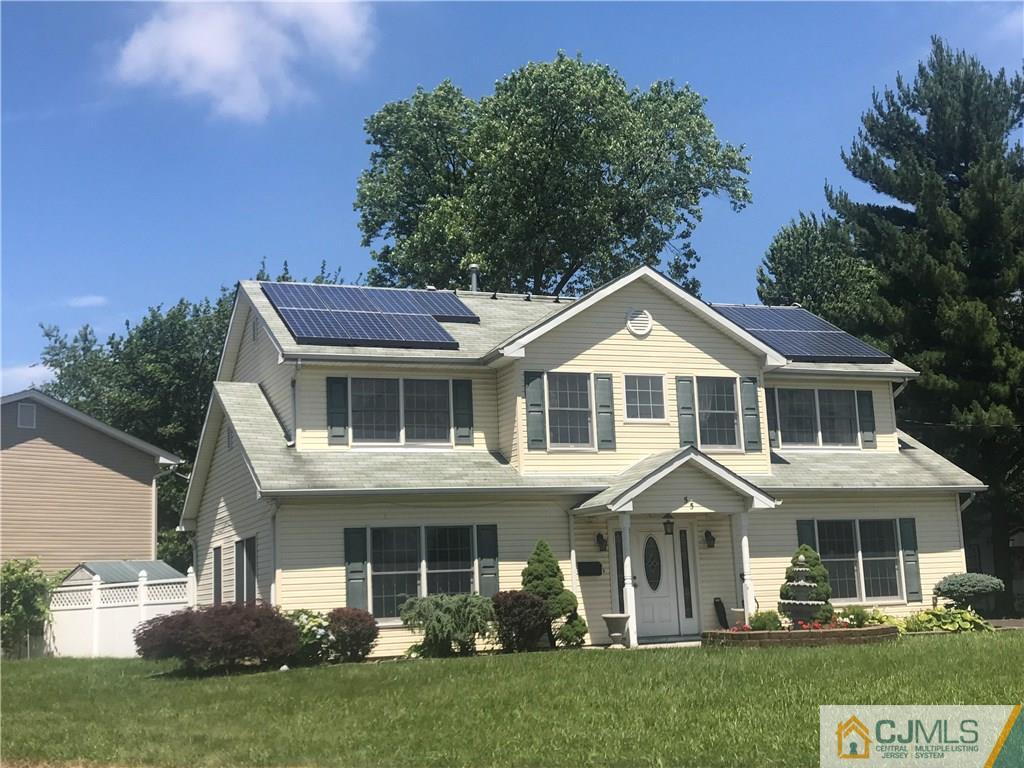 55 Knollwood Road Edison, NJ 08817 - Photo 2 of 25 a front view of a house with a yard