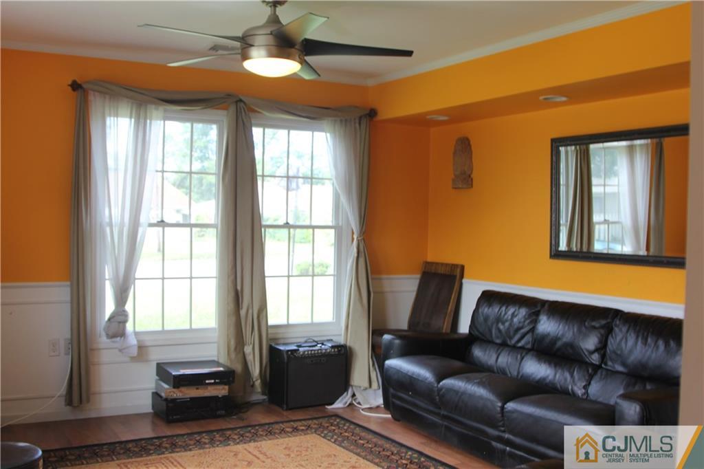 55 Knollwood Road Edison, NJ 08817 - Photo 5 of 25 a living room with a couch and a window