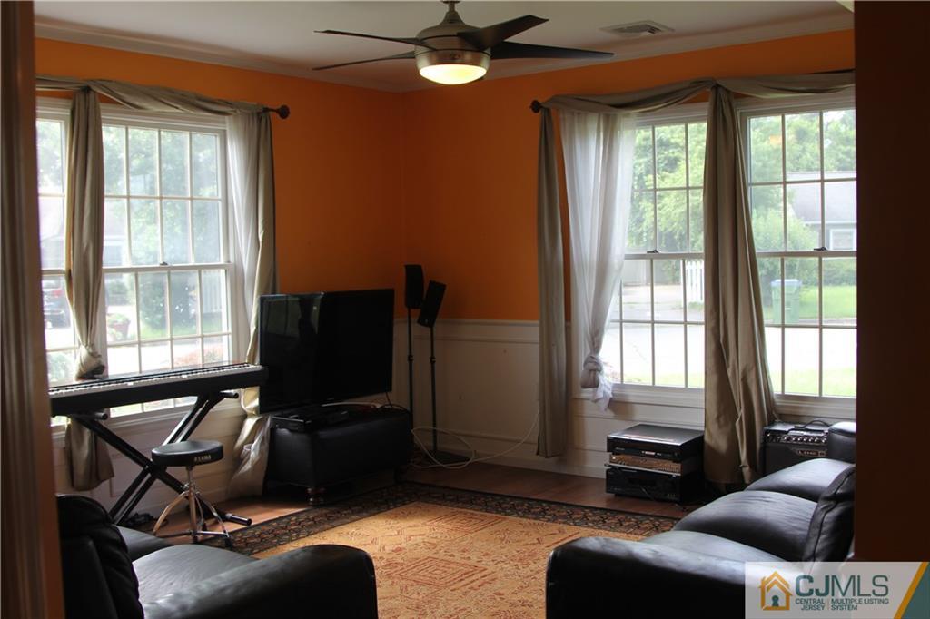 55 Knollwood Road Edison, NJ 08817 - Photo 6 of 25 a living room with furniture and a window