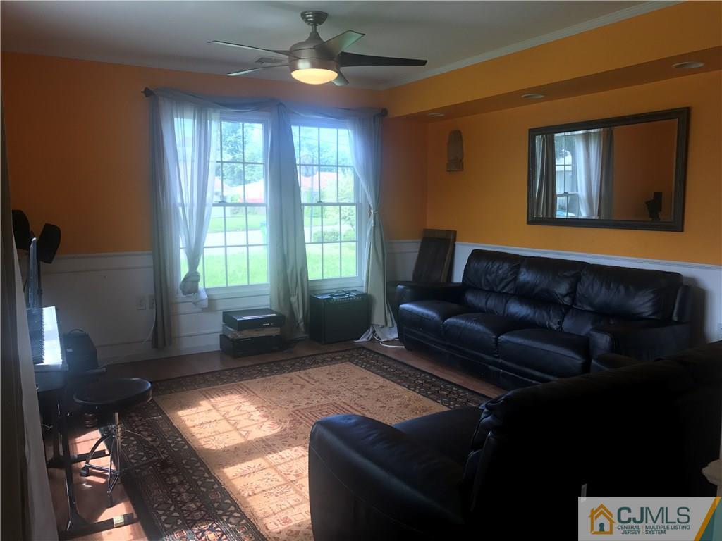 55 Knollwood Road Edison, NJ 08817 - Photo 7 of 25 a living room with furniture and a window