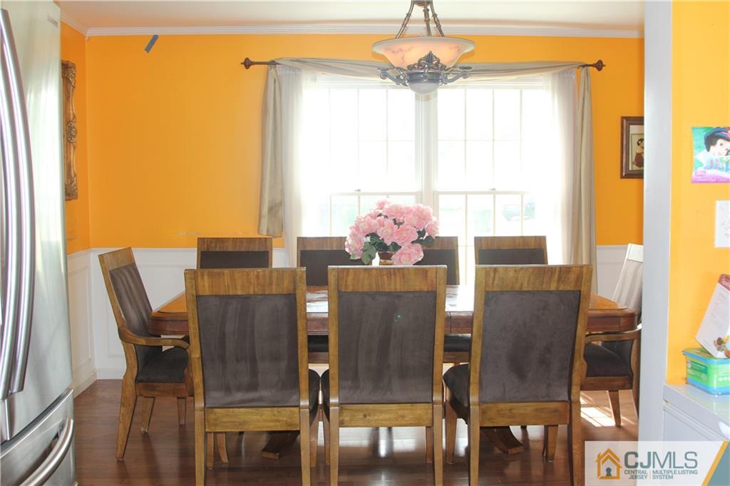 55 Knollwood Road Edison, NJ 08817 - Photo 10 of 25 a view of a dining room with furniture window and outside view