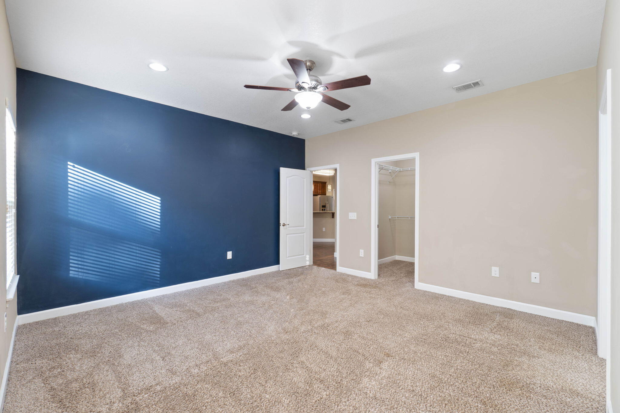 438 Brackin Street Crestview, FL 32539 - Photo 15 of 26 a view of an empty room with a ceiling fan
