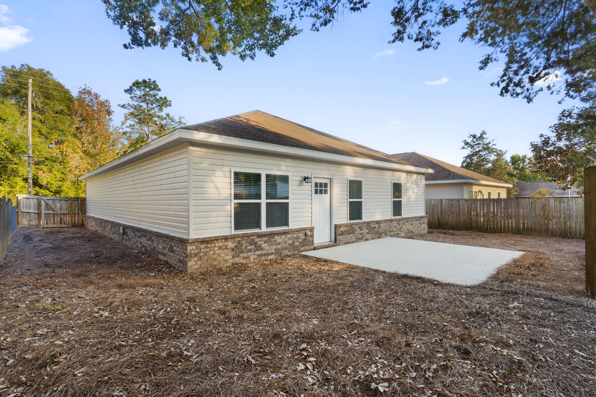 438 Brackin Street Crestview, FL 32539 - Photo 19 of 26 a view of a house with a yard and garage