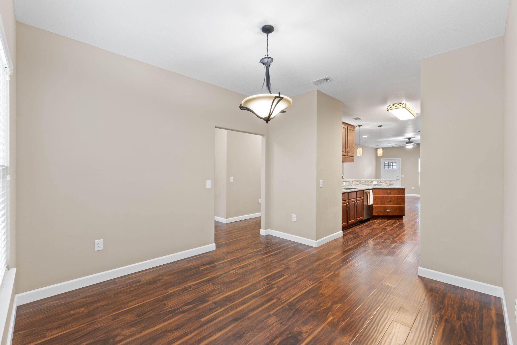 438 Brackin Street Crestview, FL 32539 - Photo 10 of 26 a view of a room with wooden floor
