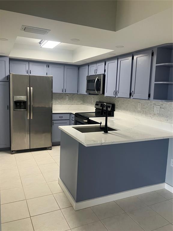 3006 Caring Way, Unit 612 Port Charlotte, FL 33952 - Photo 4 of 20 a kitchen with stainless steel appliances granite countertop a sink counter space and cabinets