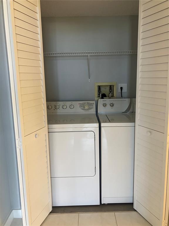 3006 Caring Way, Unit 612 Port Charlotte, FL 33952 - Photo 6 of 20 a utility room with dryer and washer