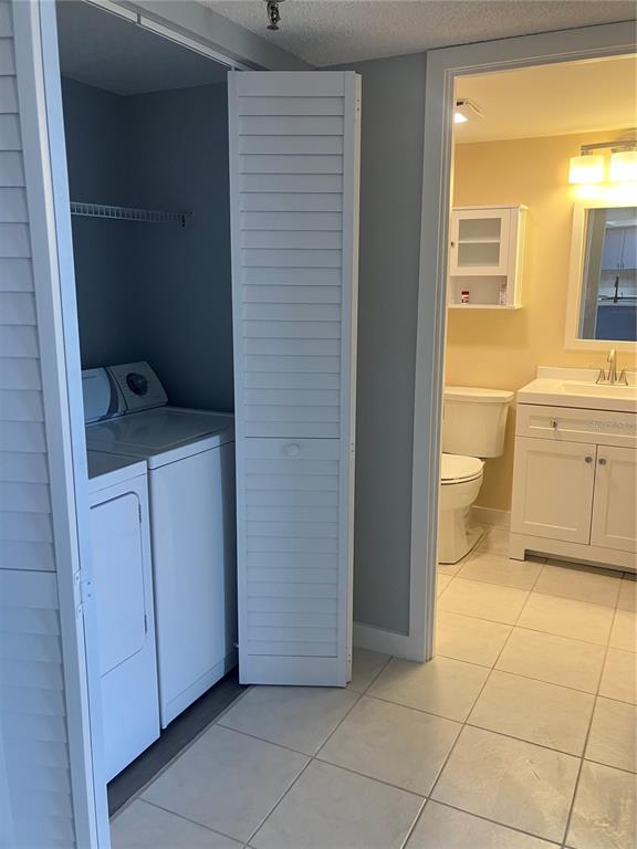3006 Caring Way, Unit 612 Port Charlotte, FL 33952 - Photo 7 of 20 a bathroom with a sink a toilet and a shower