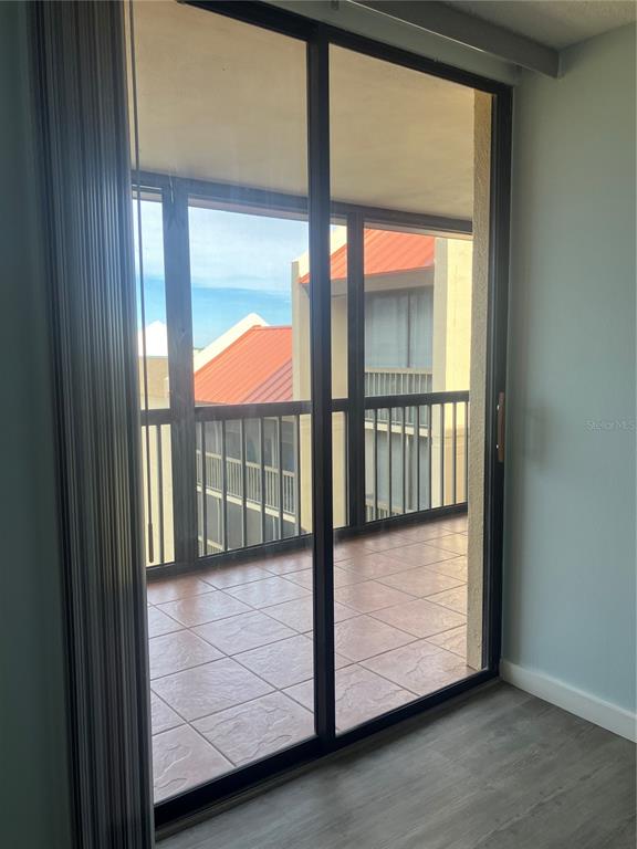 3006 Caring Way, Unit 612 Port Charlotte, FL 33952 - Photo 9 of 20 a view of a glass door with a outdoor space