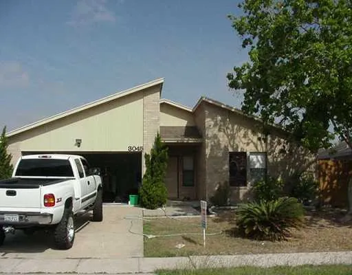 a view of a car park in front of house