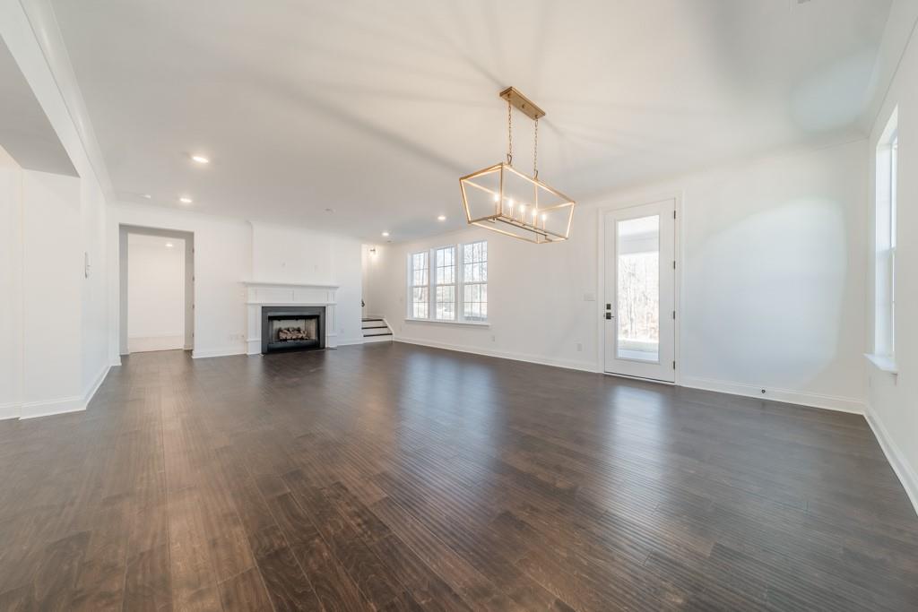 3210 Timber Run Lane Maiden, NC 28650 - Photo 13 of 30 a view of empty room with wooden floor and window