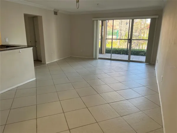 a kitchen with a sink a refrigerator and cabinets