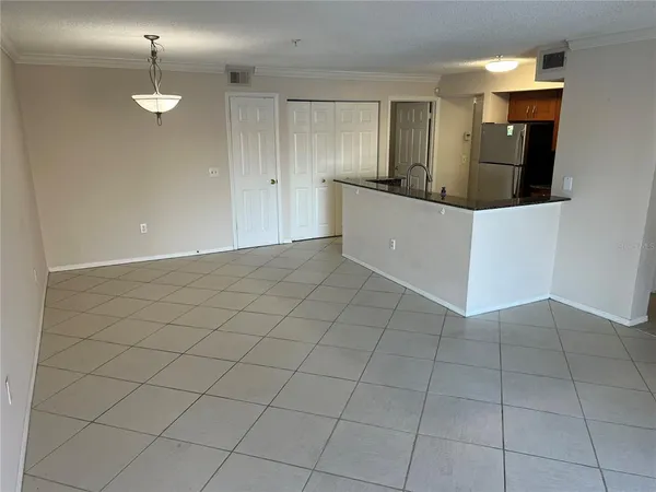 a kitchen with a sink cabinets and appliances