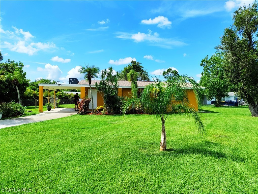 a view of a garden with a building