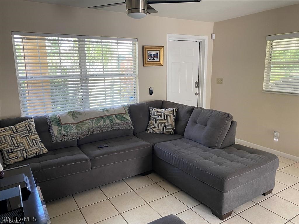 202 Davis Road Lehigh Acres, FL 33936 - Photo 4 of 16 a living room with furniture and a window