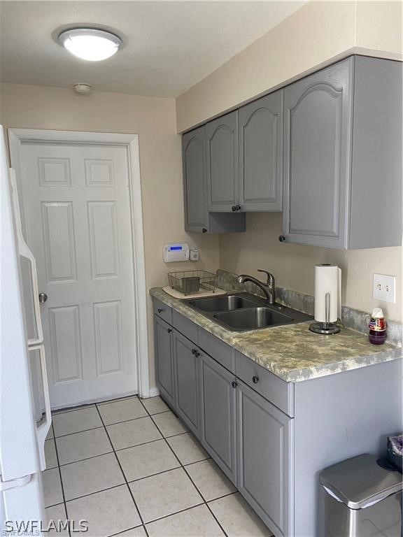 202 Davis Road Lehigh Acres, FL 33936 - Photo 6 of 16 a kitchen with a sink cabinets and utility