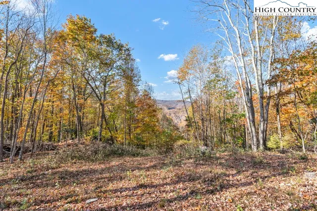 a swimming pool with an outdoor space and seating area